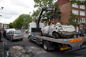 Cars being destroyed with London riots