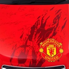 The auction will also include Wayne Rooney and Nemanja Vidic match-worn shirts