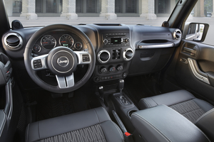 The interior gets an aluminum and leather steering wheel, black cloth seats and aluminum trim