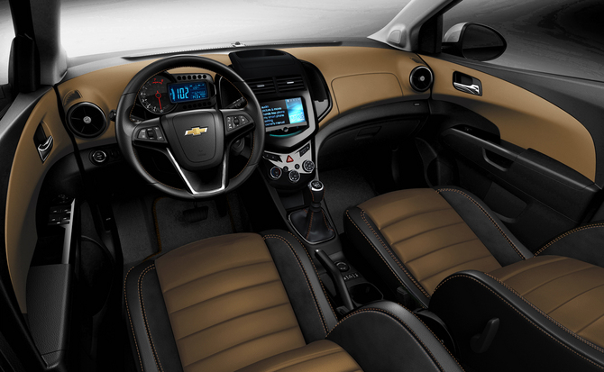 The interior gets a two-tone combination of black and tan with suede. 