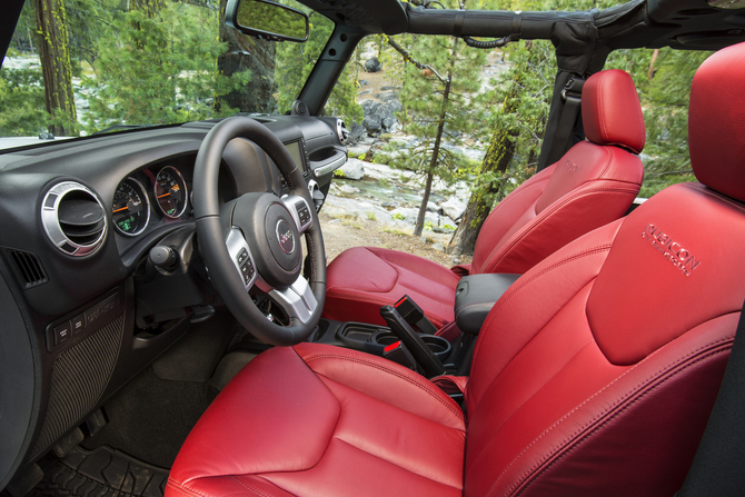 The interior is covered in red leather. The interior is covered in red leather.