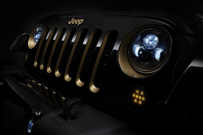 The headlights and grill of the Jeep Wrangler have been accented in gold