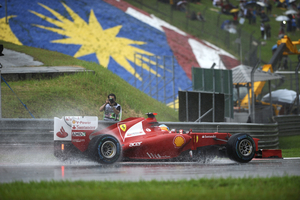 Alonso takes win in wet race in Sepang