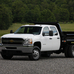 Cadillac Escalade 2WD Hybrid vs Chevrolet Silverado Work Truck Standard Box SRW