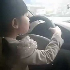 Chinese 4 Year Old Driving Car Down Motorway